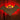 Bat-shaped decoration with glowing red eyes on a textured wooden background