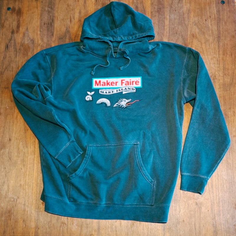 Green hoodie featuring the Maker Faire logo and design elements, perfect for showcasing your maker spirit with Maker Faire Wear.