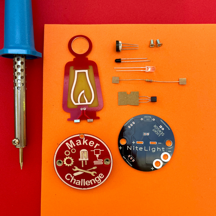 Learn To Solder - NiteLight Lantern components including circuit board, LED, and soldering tool.