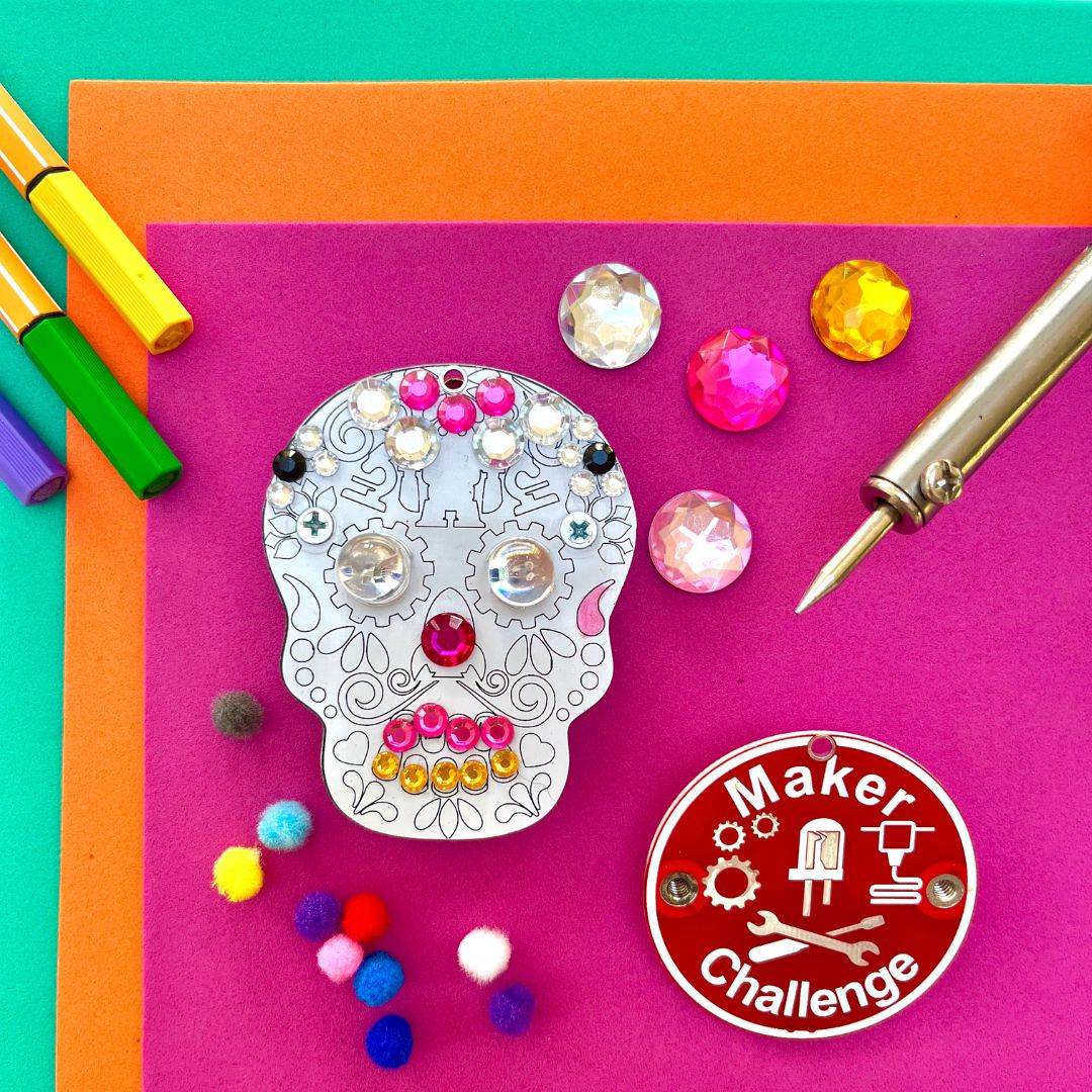 Learn To Solder - Sugar Skull with colorful decorations and components for beginner soldering projects.