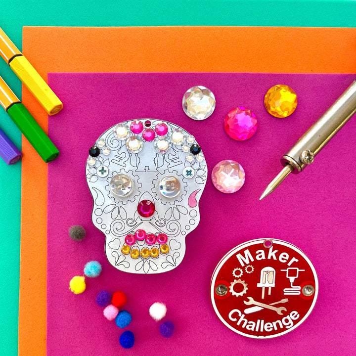 Learn To Solder - Sugar Skull with colorful decorations and components for beginner soldering projects.