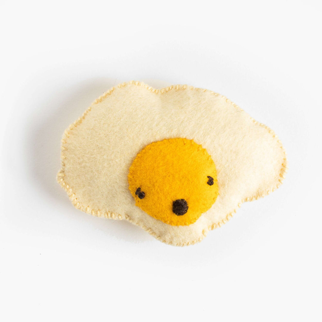 Ava the Anxious Egg Felt Stitching Kit - Cute felt egg plush with a yellow yolk, perfect for DIY projects.