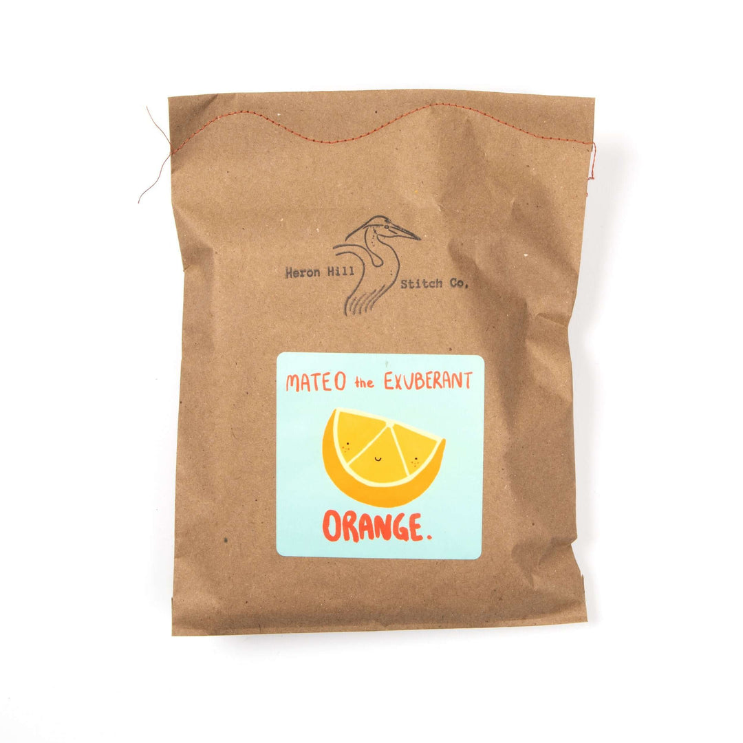 Mateo the Exuberant Orange Felt Stitching Kit packaging featuring a cute orange slice design.