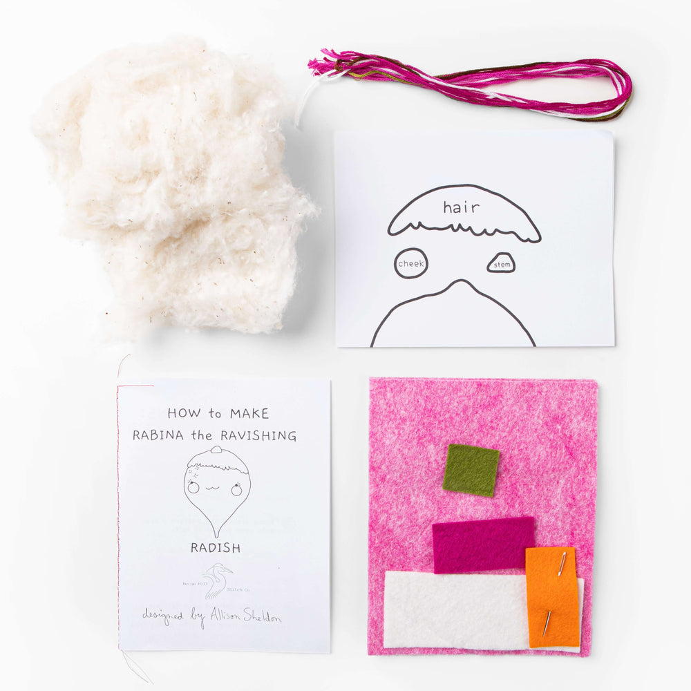 Contents of the Rabina the Ravishing Radish Felt Stitching Kit including fabric, pattern, and instructions.