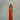 Close-up of an orange pen on a gray background