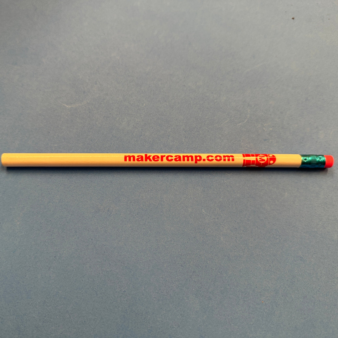 Pencil with red Makey robot and 'makercamp.com' text on a gray background