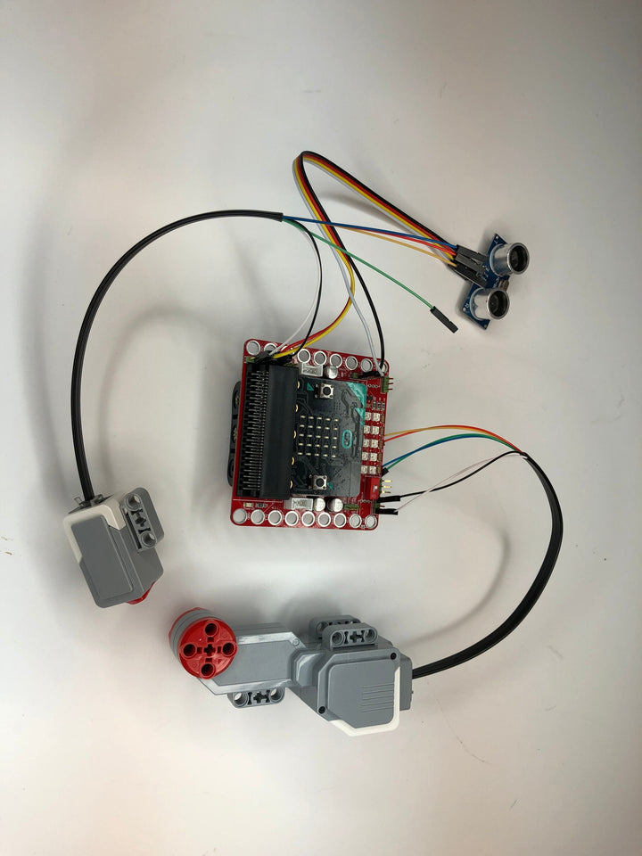 Open Hardware Cables connected to a microcontroller with sensors and an actuator.