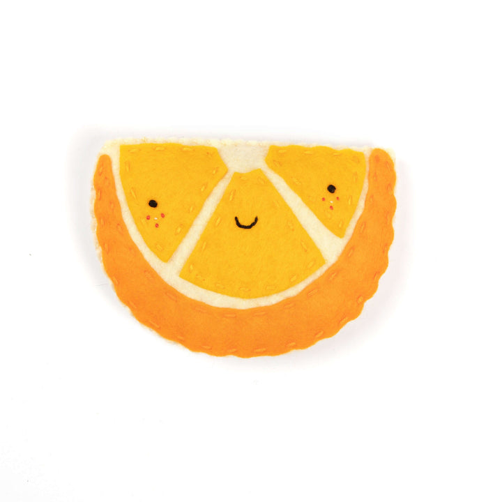 Mateo the Exuberant Orange Felt Stitching Kit featuring a vibrant orange slice character.